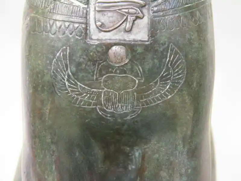 The scarabs and the udjat-eye on the chest of the Gayer-Anderson cat.